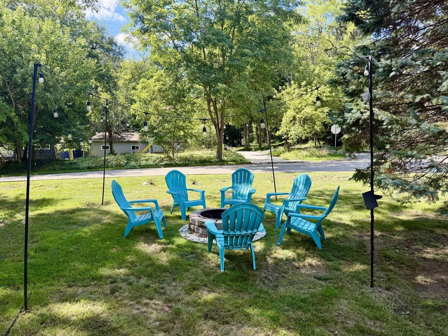 Outdoor seating and fire pit at dog-friendly Sunny Bay in Williams Bay